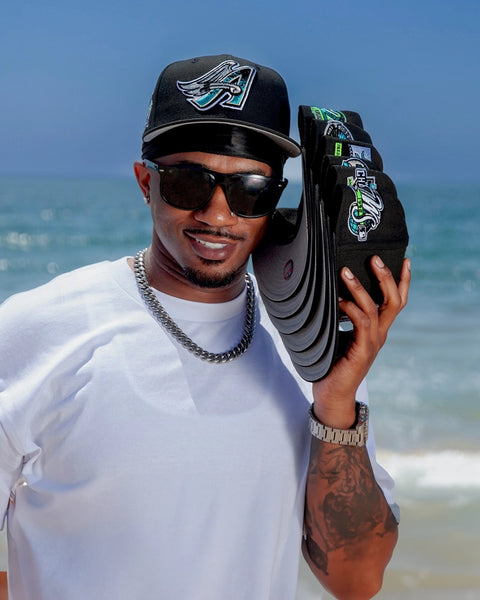 59FIFTY NEW ERA AQUA COLLECTION HERO IMAGE-MODEL ON OCEAN WEARING FITTED HAT-LOS ANGELES ANGELS